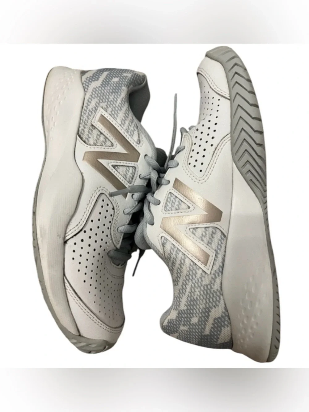 New Balance 696 V3 women’s 6.5 lace up white and gold tennis shoes